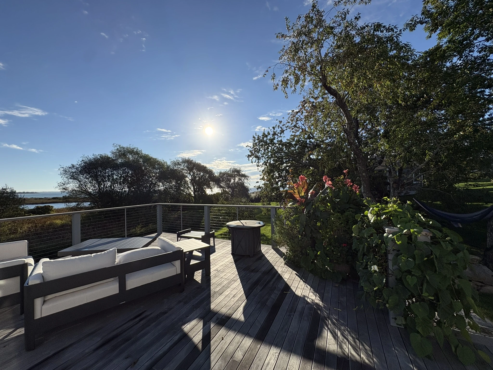 Evening light over the finished deck and roofline on Ocean Drive in Little Compton